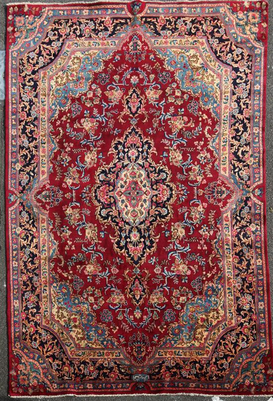 A Meshed carpet, 11ft 8in by 8ft 1in.